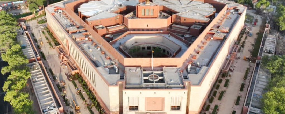 Aerial view of the new Indian Parliament building — Jan Vishwas Bill 2026